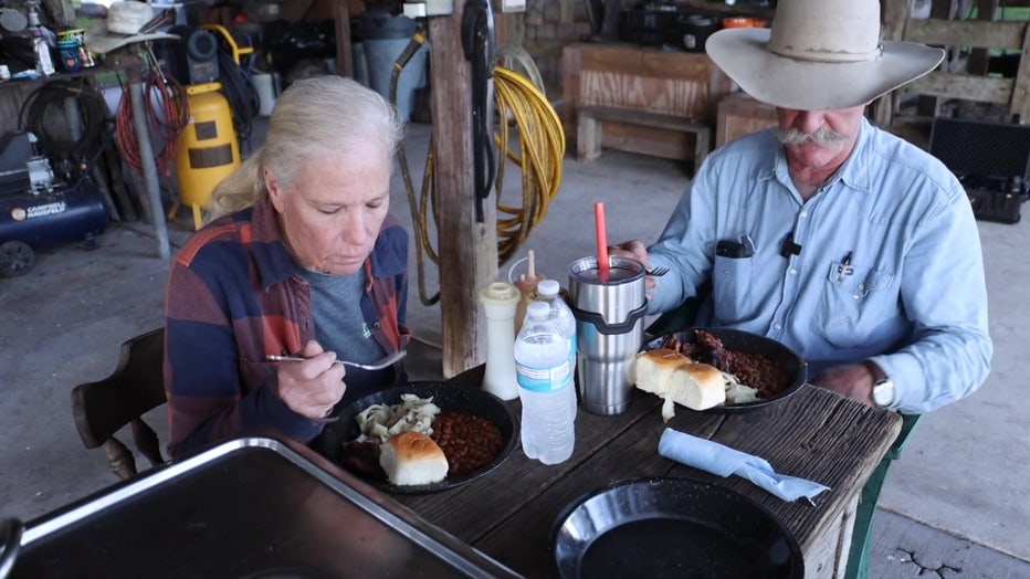 'Buddy' and his wife enjoy a meal of swamp cabbage.