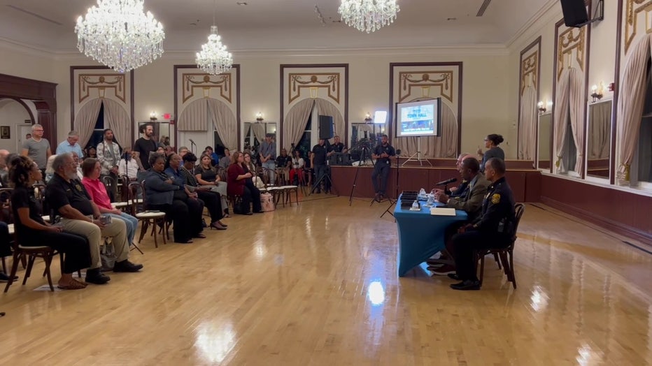Community members met with police during a town hall in Ybor City. 