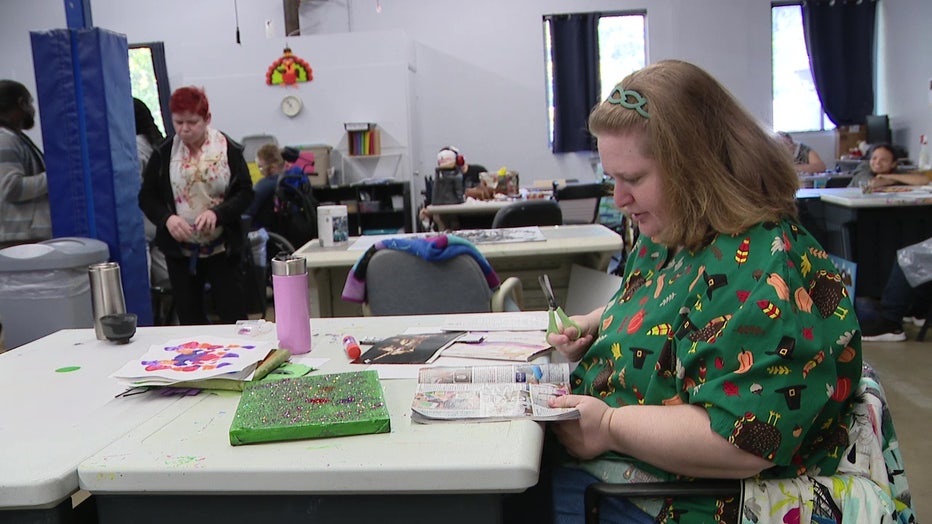A woman at Parc works on an arts and crafts project.