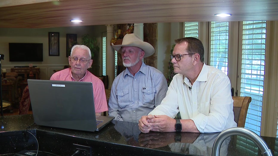 Lloyd Sowers and George and Brad Turner watch old footage from 1962 freeze. 