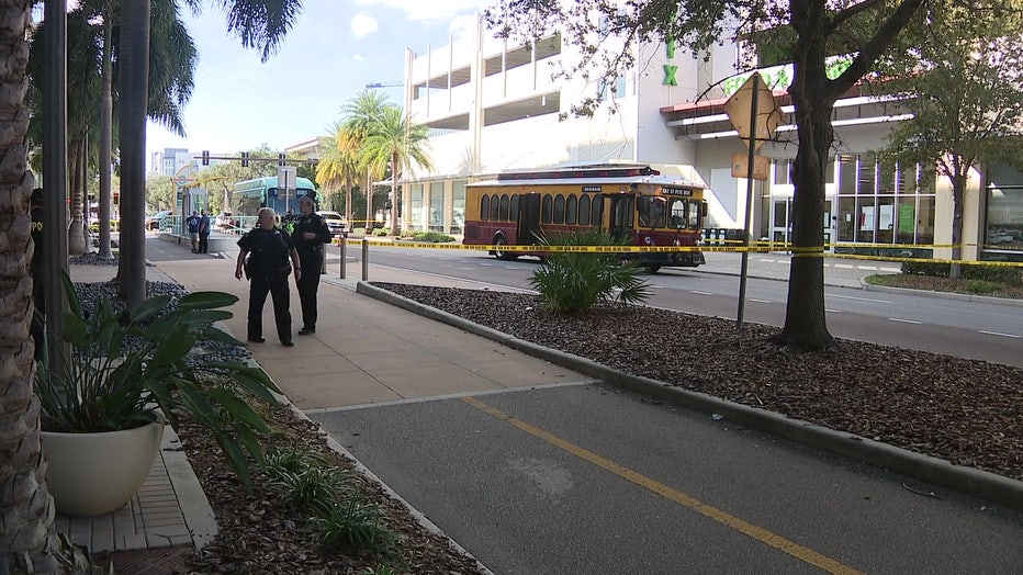 Police and crime scene tape in front of a trolley that police say struck a 15-year-old girl Sunday morning.