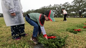 Bad weather doesn't stop Wreaths Across America Day tradition at Bay Pines National Cemetery