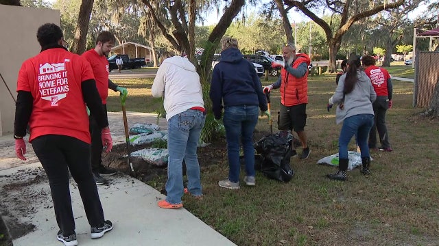 100 volunteers spend Pearl Harbor Remembrance Day sprucing up park dedicated to veterans