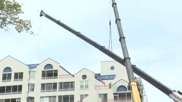 Crane lifted off Pinellas County condo days after collapsing
