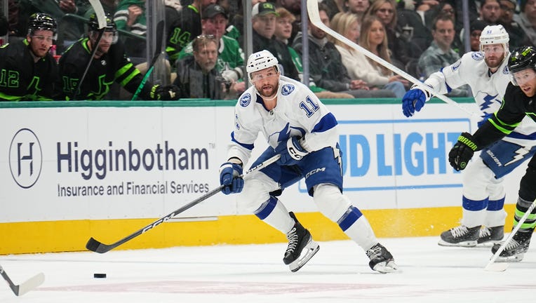 DALLAS, TX - DECEMBER 2: Luke Glendening #11 of the Tampa Bay Lightning handles the puck against the Dallas Stars at the American Airlines Center on December 2, 2023 in Dallas, Texas. (Photo by Glenn James/NHLI via Getty Images)