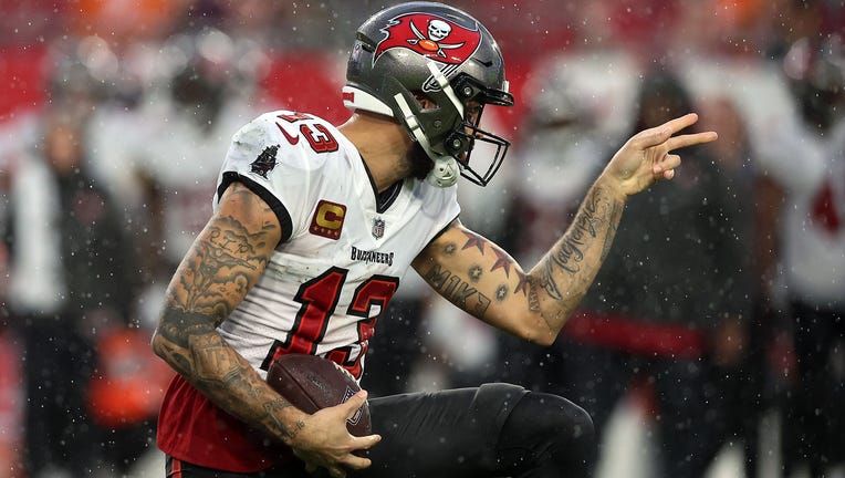 TAMPA, FLORIDA - DECEMBER 03: Mike Evans #13 of the Tampa Bay Buccaneers reacts after a first down reception against the Carolina Panthers during the first half at Raymond James Stadium on December 03, 2023 in Tampa, Florida. (Photo by Mike Carlson/Getty Images)