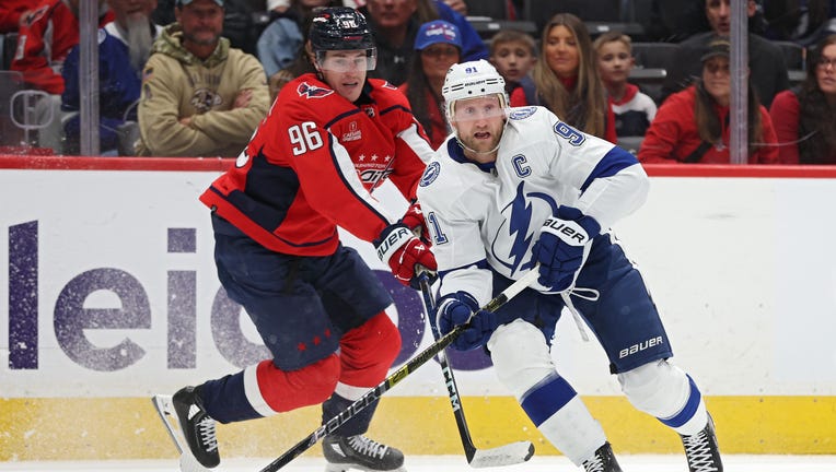 WASHINGTON, DC - DECEMBER 23: Steven Stamkos #91 of the Tampa Bay Lightning skates past Nicolas Aube-Kubel #96 of the Washington Capitals during the first period at Capital One Arena on December 23, 2023 in Washington, DC. (Photo by Patrick Smith/Getty Images)