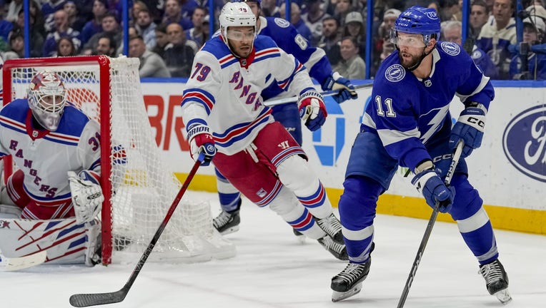 TAMPA, FL - DECEMBER 30: Tampa Bay Lightning center Luke Glendening (11) looks to make a pass during the NHL Hockey match between the Tampa Bay Lightning and New York Rangers on December 30th, 2023 at Amalie Arena in Tampa, FL. (Photo by Andrew Bershaw/Icon Sportswire via Getty Images)