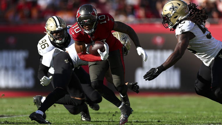 TAMPA, FL - DECEMBER 31: Trey Palmer #10 of the Tampa Bay Buccaneers carries the ball during the fourth quarter of an NFL football game against the New Orleans Saints at Raymond James Stadium on December 31, 2023 in Tampa, Florida. (Photo by Kevin Sabitus/Getty Images)