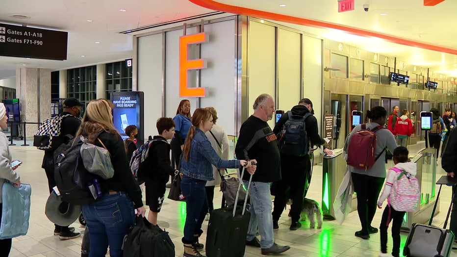 File: Travelers at the airport. 