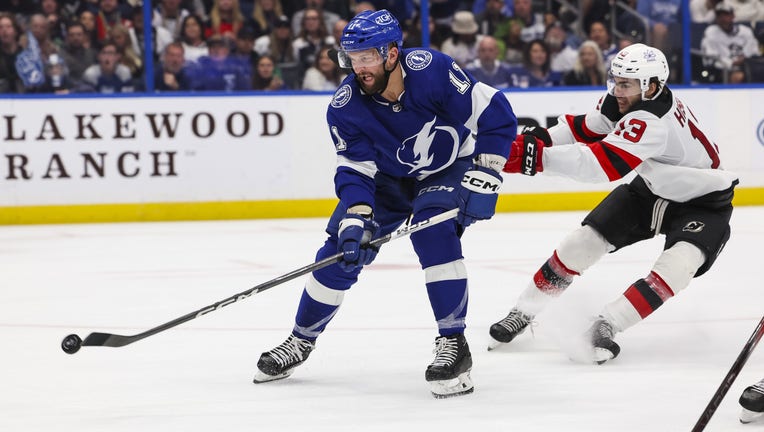 TAMPA, FL - JANUARY 27: Luke Glendening #11 of the Tampa Bay Lightning against the New Jersey Devils during the third period at Amalie Arena on January 27 2024 in Tampa, Florida. (Photo by Mark LoMoglio/NHLI via Getty Images)