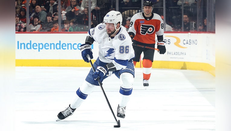 PHILADELPHIA, PENNSYLVANIA - JANUARY 23: Nikita Kucherov #86 of the Tampa Bay Lightning skates with the puck during the third periodat the Wells Fargo Center on January 23, 2024 in Philadelphia, Pennsylvania. (Photo by Tim Nwachukwu/Getty Images)