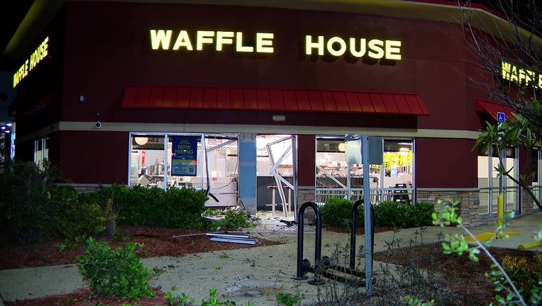 Exterior of a Lakeland Waffle House with damage after police say an SUV crashed into it. 