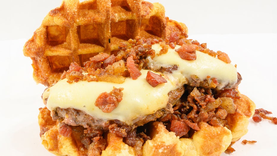 100% All beef patty’s topped with cheddar cheese and applewood smoked bacon in between two Belgian waffles with pearl sugar baked into the waffle.. Courtesy: Florida State Fair. 