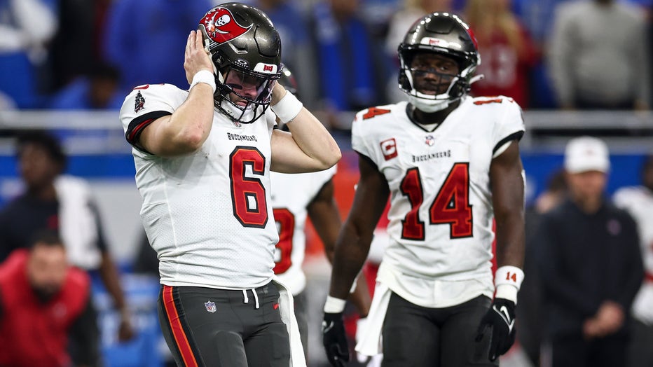 DETROIT, MI - JANUARY 21: Baker Mayfield #6 of the Tampa Bay Buccaneers covers his ears to hear a play call during the second quarter of an NFL divisional round playoff football game against the Detroit Lions at Ford Field on January 21, 2024 in Detroit, Michigan. (Photo by Kevin Sabitus/Getty Images)