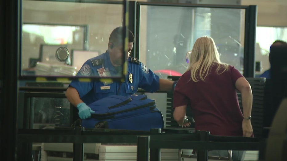 File: Passengers moving through TSA checkpoint