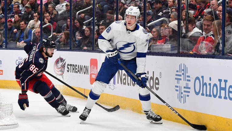 COLUMBUS, OHIO - FEBRUARY 10: Emil Martinsen Lilleberg #78 of the Tampa Bay Lightning skates with the puck as Kirill Marchenko #86 of the Columbus Blue Jackets defends during the first period of a game at Nationwide Arena on February 10, 2024 in Columbus, Ohio. (Photo by Ben Jackson/NHLI via Getty Images)