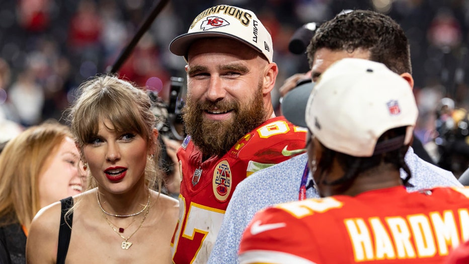 Travis Kelce #87 of the Kansas City Chiefs and Taylor Swift react as they see Mecole Hardman Jr. #12 of the Kansas City Chiefs following the NFL Super Bowl 58 football game between the San Francisco 49ers and the Kansas City Chiefs at Allegiant Stadium on Feb. 11, 2024, in Las Vegas, Nevada. (Photo by Michael Owens/Getty Images)