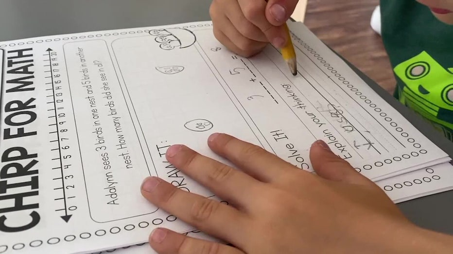 File: Student doing classwork. 