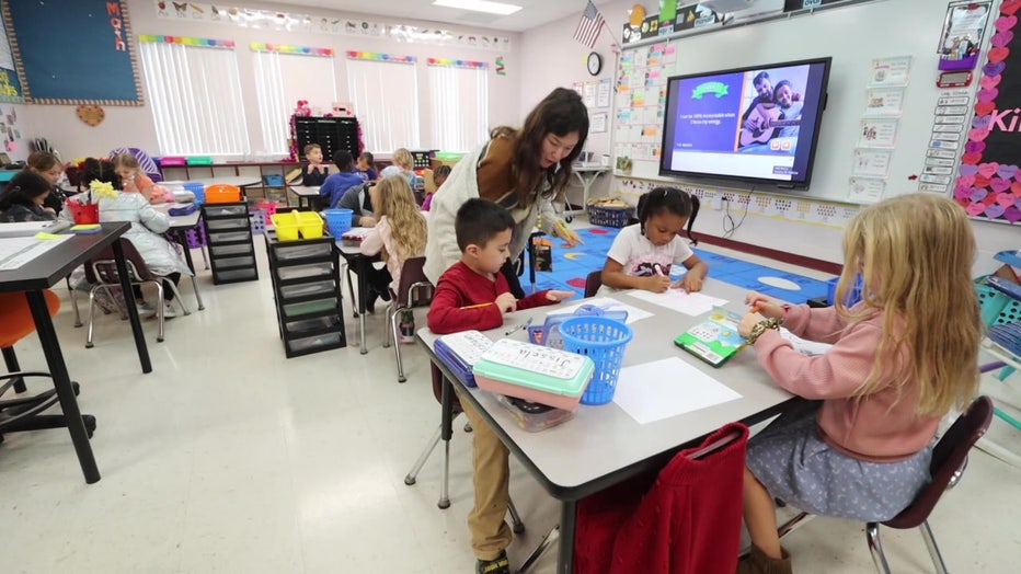 A teacher gives instructions at Collins K-8 school. 