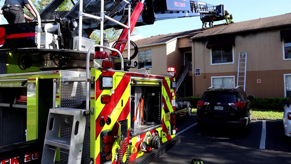 PHOTOS: Tampa apartment catches fire, 1 firefighter injured: HCFR
