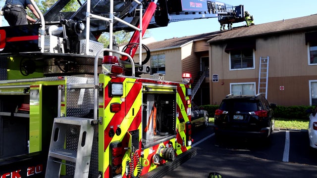 PHOTOS: Tampa apartment catches fire, 1 firefighter injured: HCFR