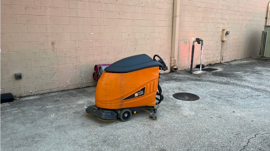 The floor cleaning machine was removed from the building and placed safely outside