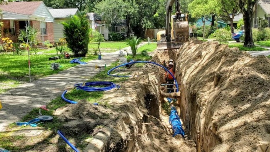 Crews installing wastewater pipes are also planting trees.