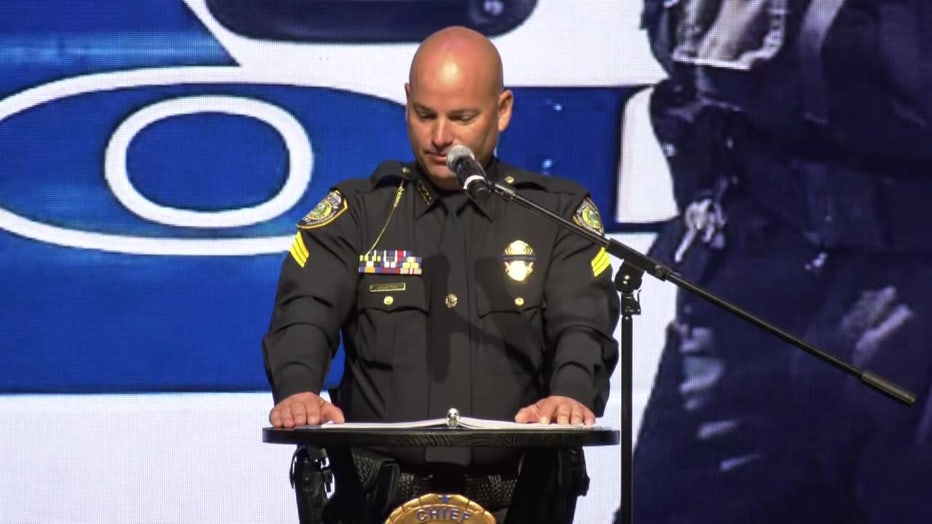 Dale Hampton speaks at a memorial service for K-9 Max. 