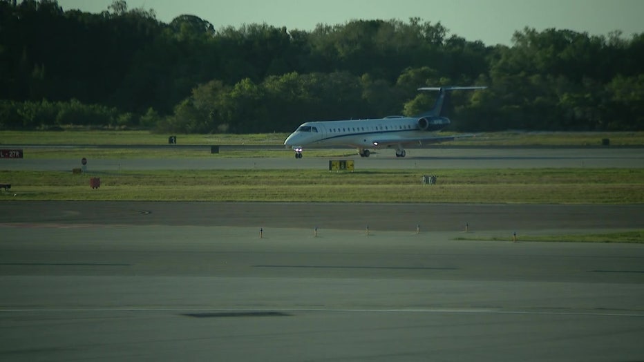 A plane carrying 14 Floridians landed in Sanford on Wednesday night.