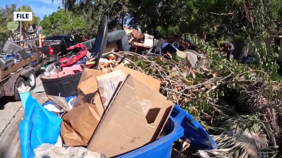 File: Trash piled up in Shore Acres after a flood. 