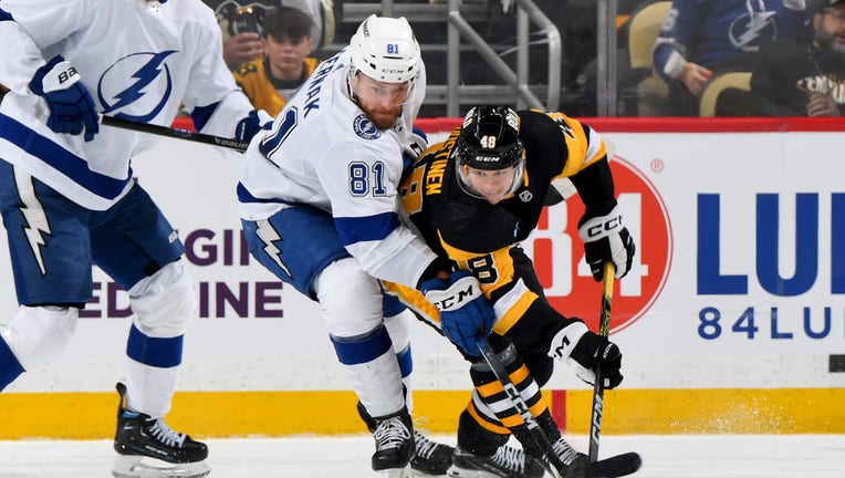 PITTSBURGH, PA - APRIL 06: Jesse Puljujarvi #18 of the Pittsburgh Penguins and Erik Cernak #81 of the Tampa Bay Lightning battle at PPG PAINTS Arena on April 6, 2024 in Pittsburgh, Pennsylvania. (Photo by Joe Sargent/NHLI via Getty Images)