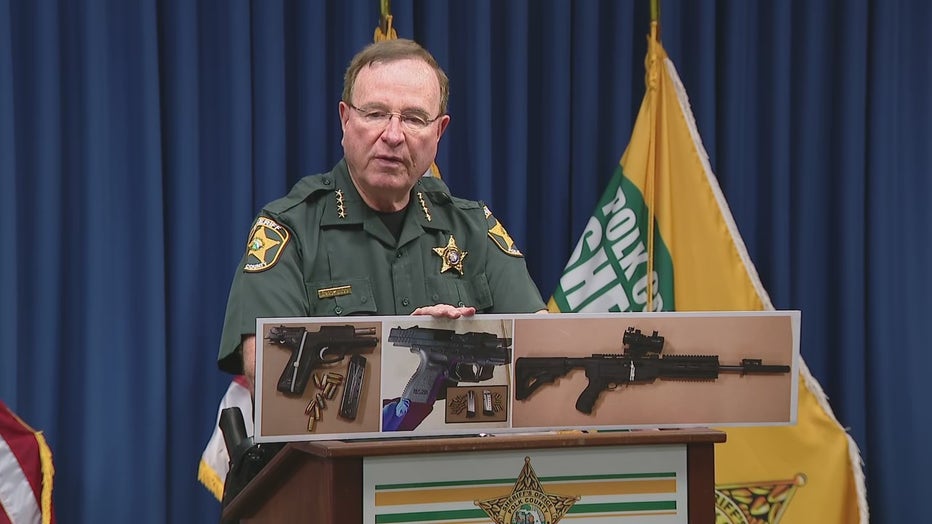 Polk Co. Sheriff Grady Judd shows the weapons found in the suspect's car. 