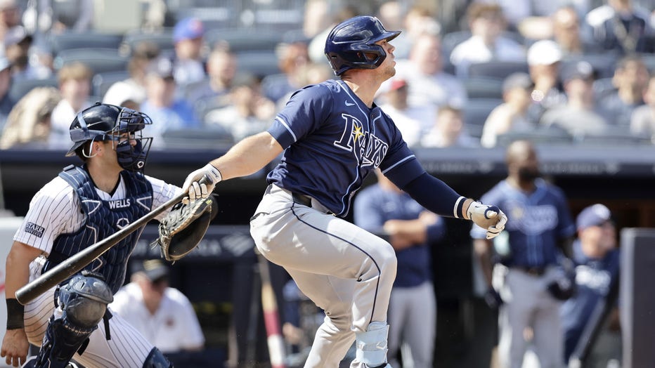 NEW YORK, NEW YORK - APRIL 20: Ben Rortvedt #30 of the Tampa Bay Rays follows through on his tenth inning RBI base hit against the New York Yankees at Yankee Stadium on April 20, 2024 in New York City. (Photo by Jim McIsaac/Getty Images)
