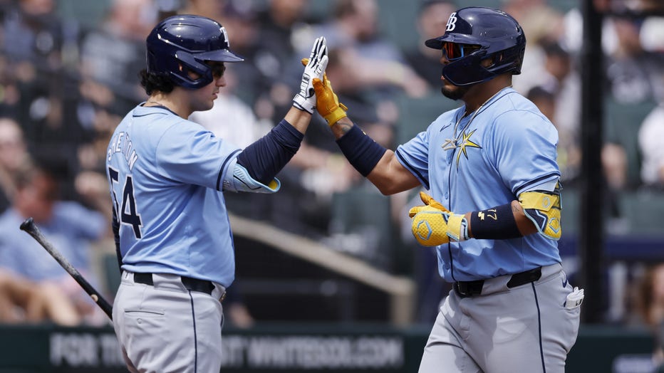CHICAGO, IL - APRIL 28: Tampa Bay Rays third baseman Isaac Paredes (17) celebrates with designated hitter Austin Shenton (54) after hitting a solo home run in the fourth inning of an MLB game against the Chicago White Sox on April 28, 2024 at Guaranteed Rate Field in Chicago, Illinois. (Photo by Joe Robbins/Icon Sportswire via Getty Images)