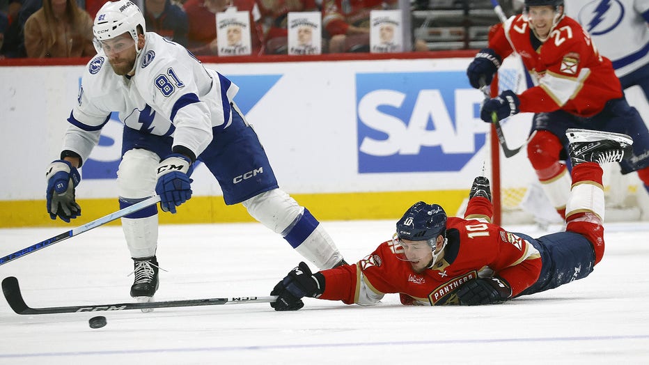 SUNRISE, FLORIDA - APRIL 29: Vladimir Tarasenko #10 of the Florida Panthers reaches out for the puck against Erik Cernak #81 of the Tampa Bay Lightning in Game Five of the First Round of the 2024 Stanley Cup Playoffs at the Amerant Bank Arena on April 29, 2024 in Sunrise, Florida. (Photo by Eliot J. Schechter/NHLI via Getty Images)