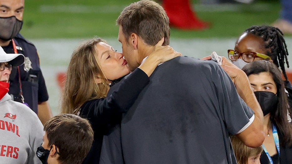 TAMPA, FLORIDA - FEBRUARY 07: Tom Brady #12 of the Tampa Bay Buccaneers celebrates with Gisele Bundchen after winning Super Bowl LV at Raymond James Stadium on February 07, 2021 in Tampa, Florida. (Photo by Kevin C. Cox/Getty Images)