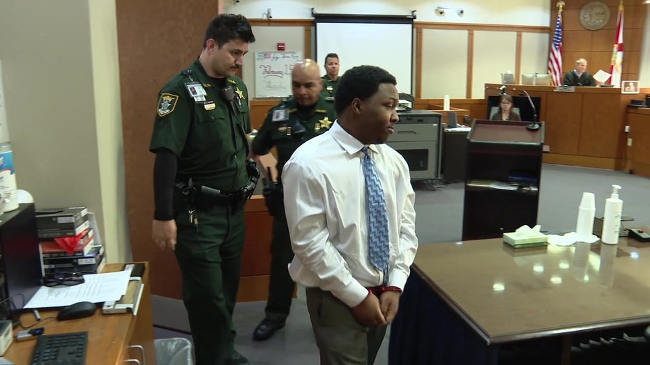 Nyquan Priester enters a Sarasota courtroom. 