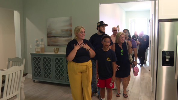 Family of late firefighter moves into mortgage-free home: 'I'm speechless'