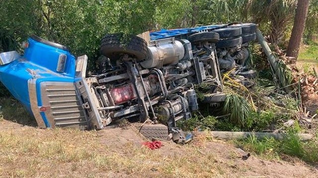 Dump truck crash starts brush fire, causes power outages in Haines City: Officials