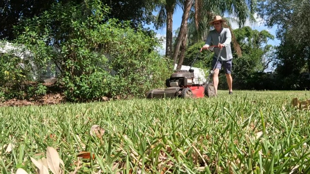 Bay Area volunteers supporting military families by mowing lawns