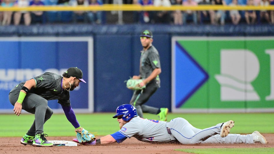 ST PETERSBURG, FLORIDA - MAY 04: Jose Caballero #7 of the Tampa Bay Rays tags Harrison Bader #44 of the New York Mets out at second base on an attempted steal in the second inning at Tropicana Field on May 04, 2024 in St Petersburg, Florida. (Photo by Julio Aguilar/Getty Images)