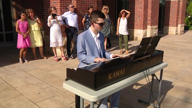 Pianist living with autism plays keyboard connected to University of Tampa's musical sculpture