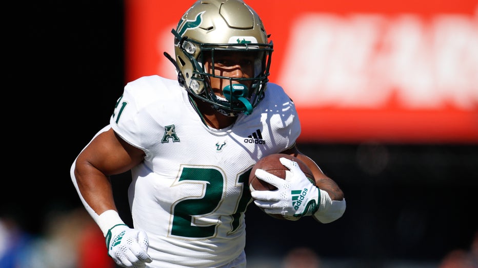 CINCINNATI, OH - OCTOBER 08: South Florida Bulls running back Brian Battie (21) carries the ball during the game against the South Florida Bulls and the Cincinnati Bearcats on October 8, 2022, at Nippert Stadium in Cincinnati, OH. (Photo by Ian Johnson/Icon Sportswire via Getty Images)