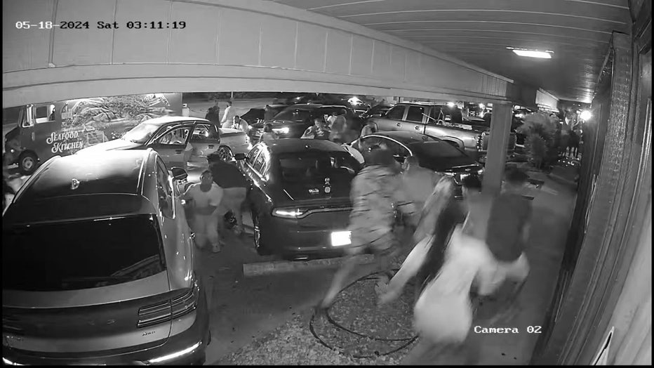 Video shows crowds running after shots were fired outside a Sarasota hookah lounge.