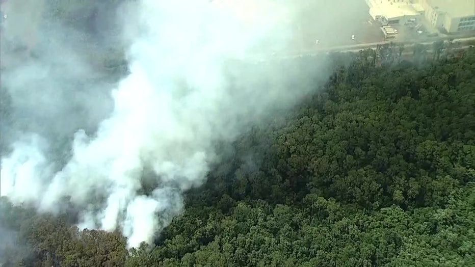 A brush fire on Thursday threatened a jail but firefighters were able to contain it before it got to the building.