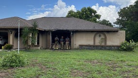 Firefighters extinguish Spring Hill house fire while battling heavy rain and lightning, officials say