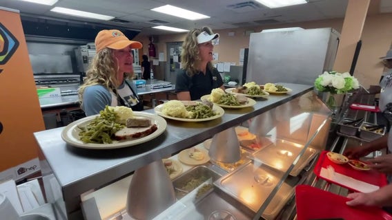 Hometown Olympic gold medalists serve dinner to Clearwater families in need