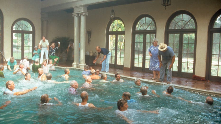 American actors Wilford Brimley, Hume Cronyn and Don Ameche at the edge of a swimming pool acting in the film Cocoon. 1985 (Photo by Mondadori via Getty Images)