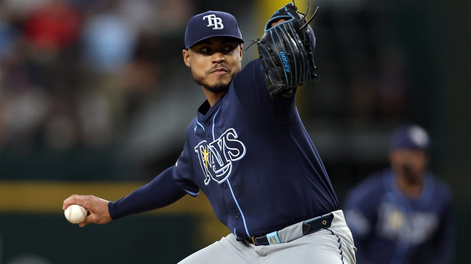 ARLINGTON, TEXAS - JULY 06: Taj Bradley #45 of the Tampa Bay Rays throws a pitch in the first inning against the Texas Rangers at Globe Life Field on July 06, 2024 in Arlington, Texas. (Photo by Tim Heitman/Getty Images)